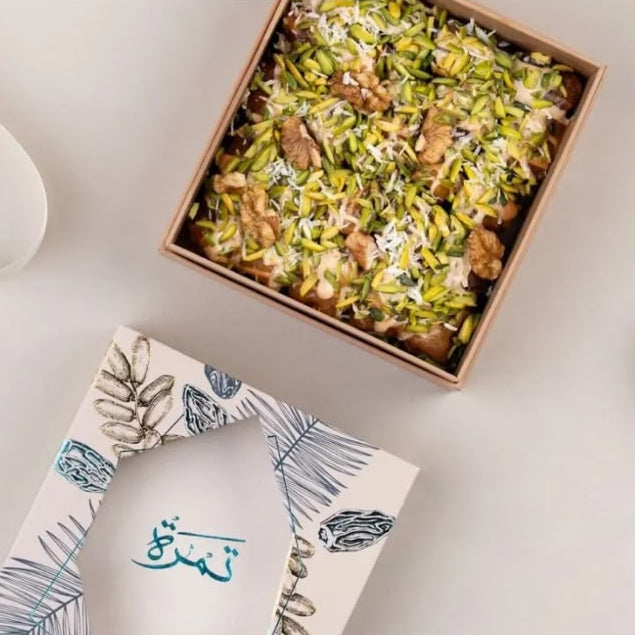 Taghmisa Sukkari Mastic dates in a gift box with Tamra Choco branding