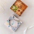 Taghmisa Sukkari Lotus dates filled with Lotus cream in a Tamra Choco gift box